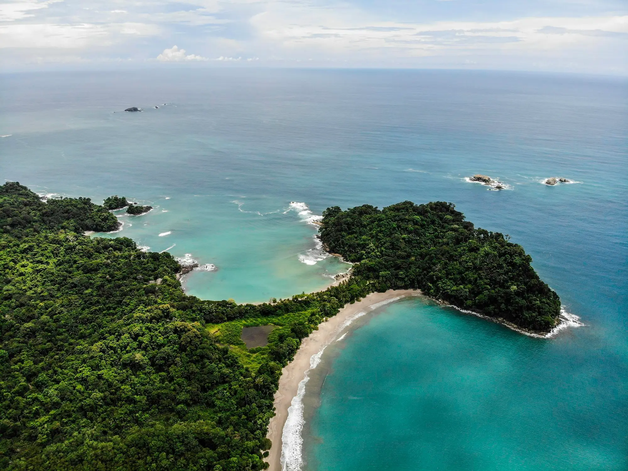 Aerial view of forested coastline, coves, and beaches around Manuel Antonio on Costa Rica's Pacific coast
